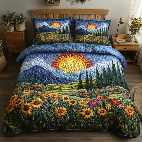 Sunrise Dreams quilted 3-piece bedding set on a made bed with two matching pillow shams