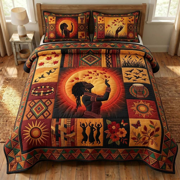 Sunrise Spirit quilted 3-piece bedding set on a made bed with two matching pillow shams