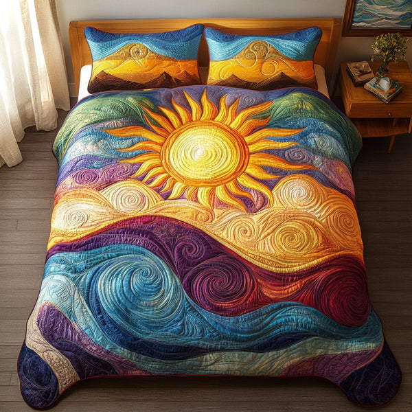 Sunrise Symphony quilted 3-piece bedding set on a made bed with two matching pillow shams