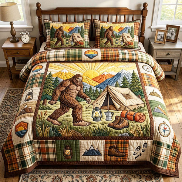 Sunset Bigfoot quilted 3-piece bedding set on a made bed with two matching pillow shams