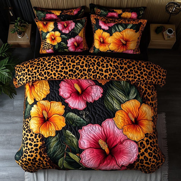 Sunset Bloom quilted 3-piece bedding set on a made bed with two matching pillow shams