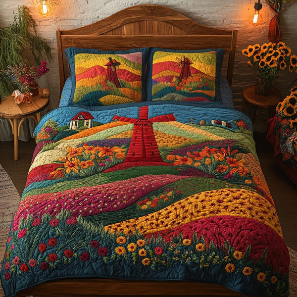 Sunset Breeze quilted 3-piece bedding set on a made bed with two matching pillow shams