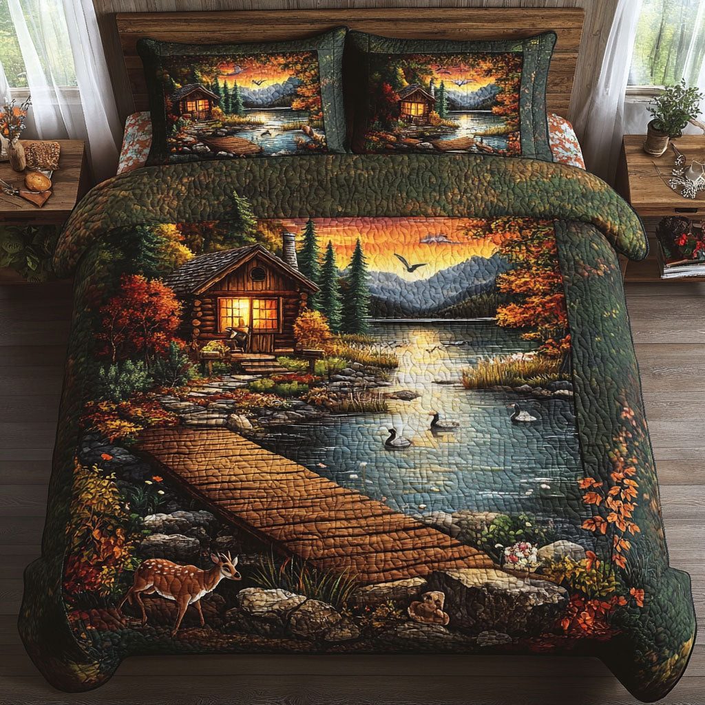 Sunset Cabin Lake quilted 3-piece bedding set on a made bed with two matching pillow shams