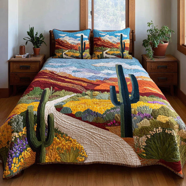 Sunset Canyon quilted 3-piece bedding set on a made bed with two matching pillow shams