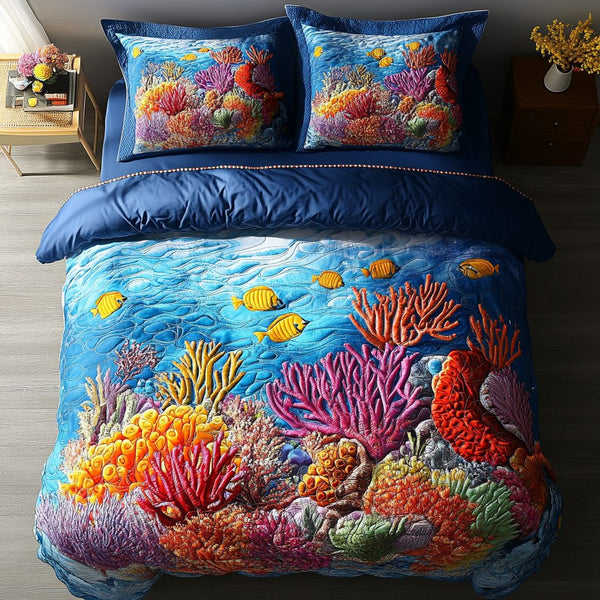 Sunset Coral quilted 3-piece bedding set on a made bed in a light coastal bedroom