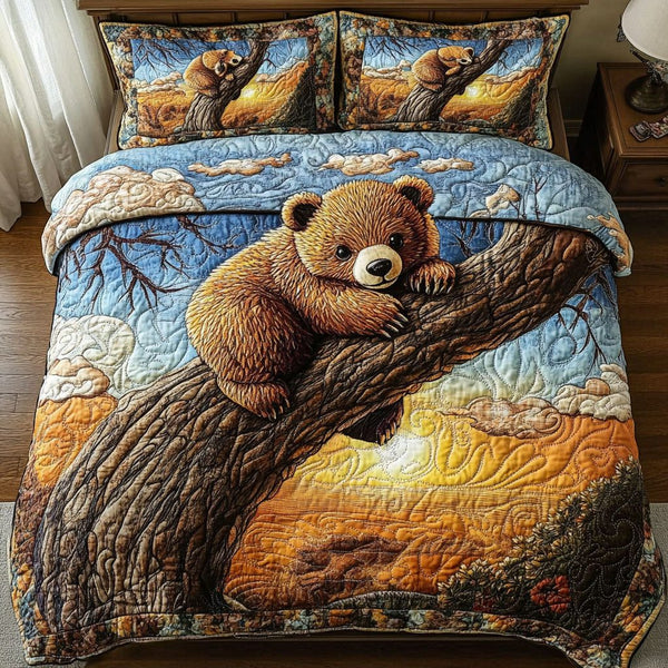 Sunset Cub quilted 3-piece bedding set on a made bed with two matching pillow shams