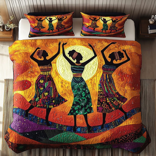 Sunset Dancer quilted 3-piece bedding set on a made bed with two matching pillow shams