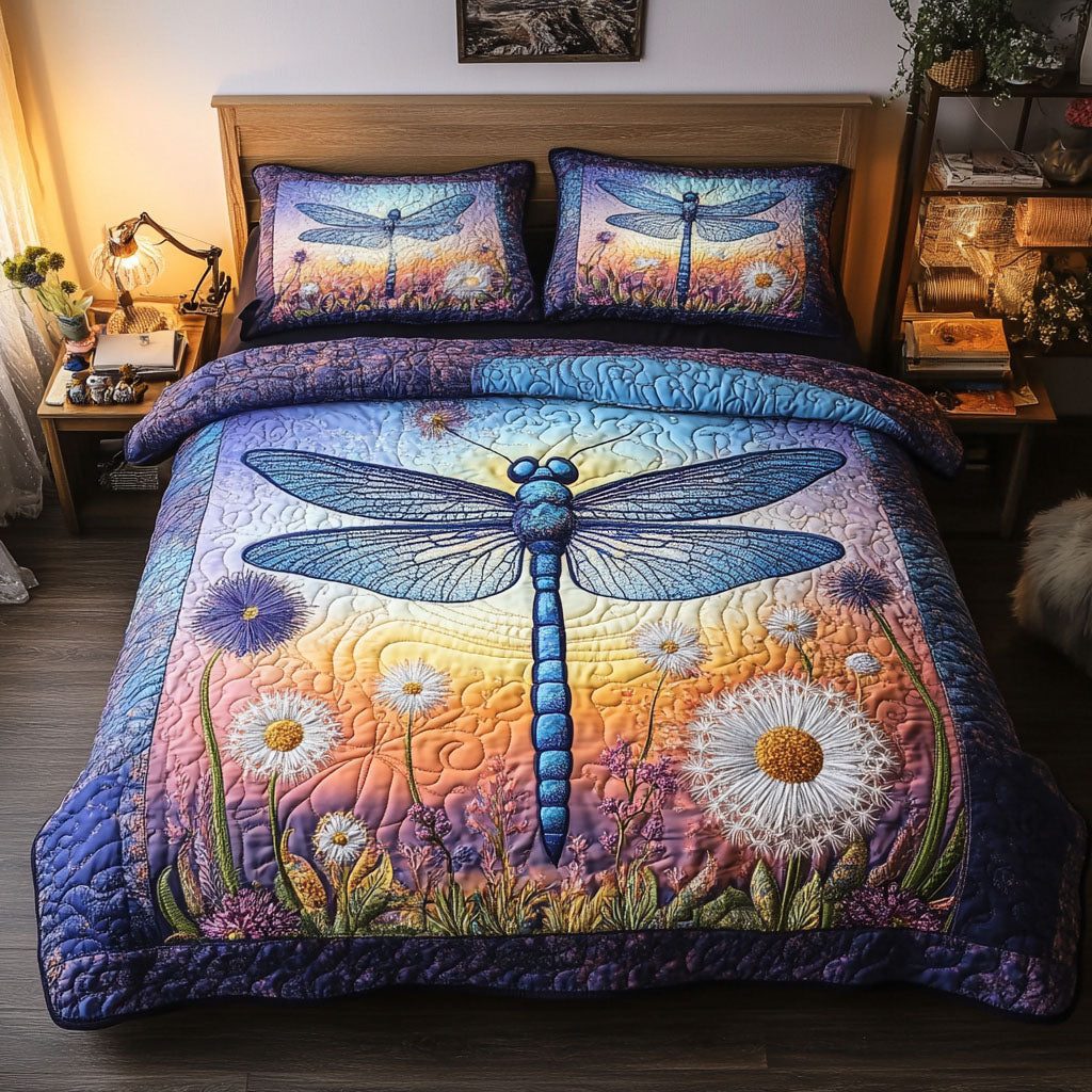 Sunset Dragonfly quilted 3-piece bedding set on a made bed with two matching pillow shams