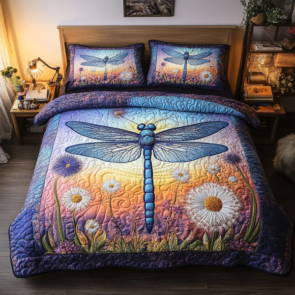 Sunset Dragonfly quilted 3-piece bedding set on a made bed with two matching pillow shams