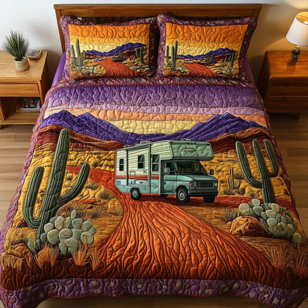 Sunset Drive quilted 3-piece bedding set on a made bed with two matching pillow shams