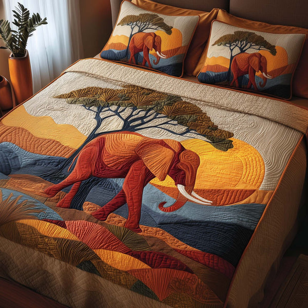 Sunset Elephant quilted 3-piece bedding set on a made bed with two matching pillow shams