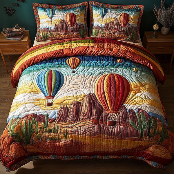 Sunset Flight quilted 3-piece bedding set on a made bed with two matching pillow shams