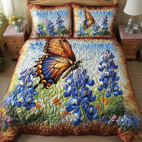 Sunset Flutter quilted 3-piece bedding set on a made bed with two matching pillow shams