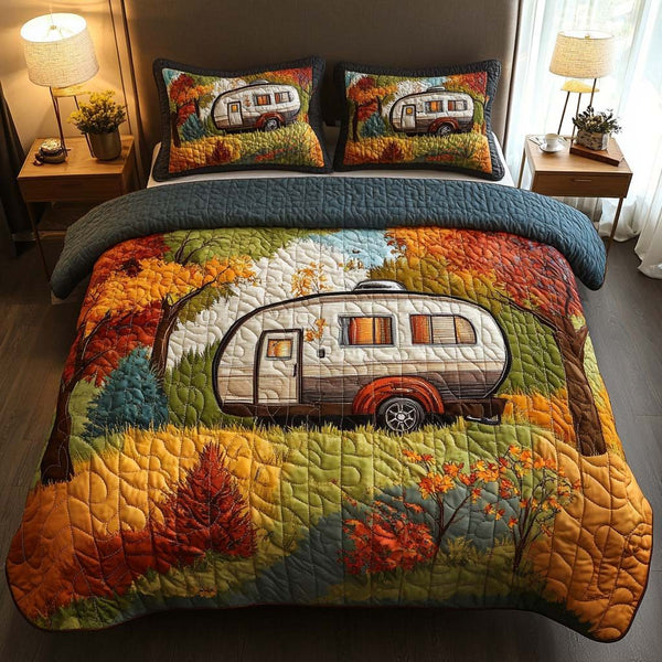 Sunset Forest Camper quilted 3-piece bedding set on a made bed with two matching pillow shams