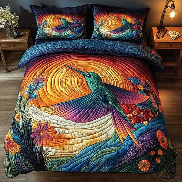 Sunset Glide quilted 3-piece bedding set on a made bed with two matching pillow shams