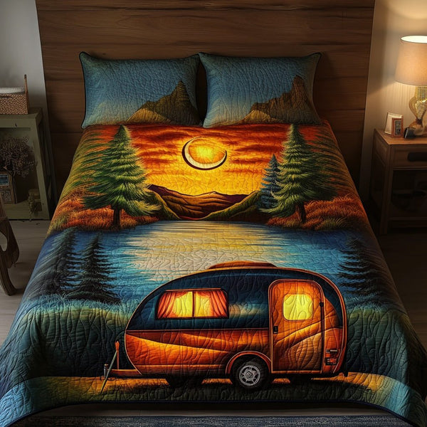 Sunset Haven quilted 3-piece bedding set on a made bed with two matching pillow shams