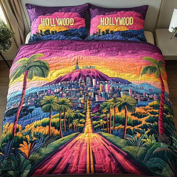 Sunset Los Angeles quilted 3-piece bedding set on a made bed in a softly lit bedroom