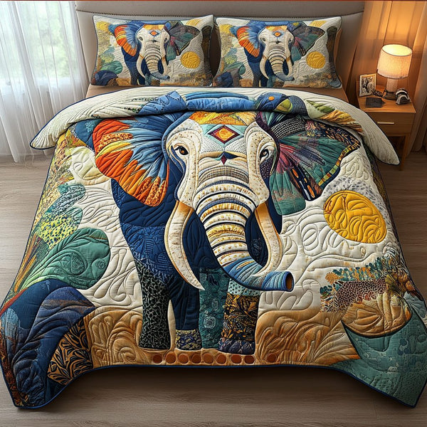 Sunset Majesty quilted 3-piece bedding set on a made bed with two matching pillow shams