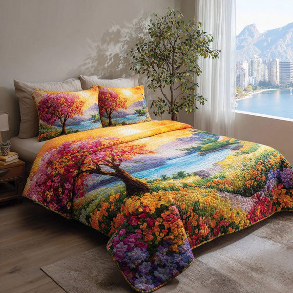 Sunset Meadow quilted 3-piece bedding set on a made bed with two matching pillow shams