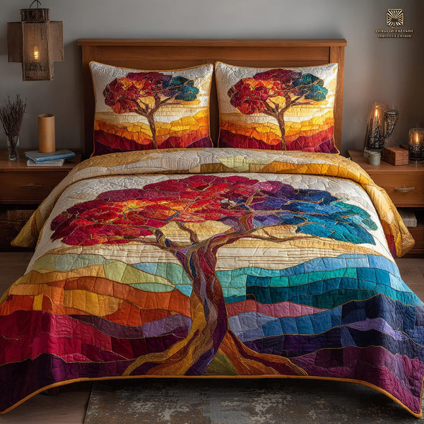 Sunset Mosaic quilted 3-piece bedding set on a made bed with two matching pillow shams