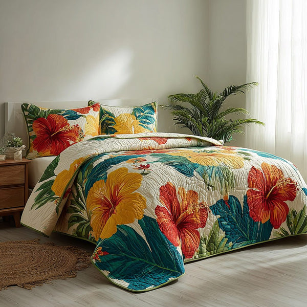 Sunset Paradise quilted 3-piece bedding set on a made bed with two matching pillow shams