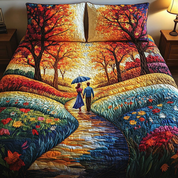 Sunset Promenade quilted 3-piece bedding set on a made bed with two matching pillow shams