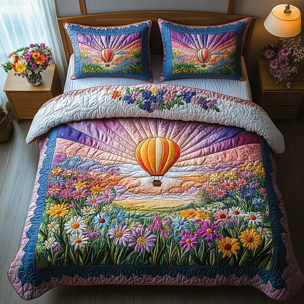 Sunset Sail quilted 3-piece bedding set on a made bed in a light coastal bedroom