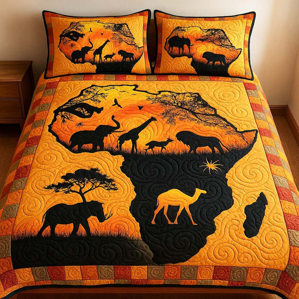 Sunset Savannah Map quilted 3-piece bedding set on a made bed with two matching pillow shams