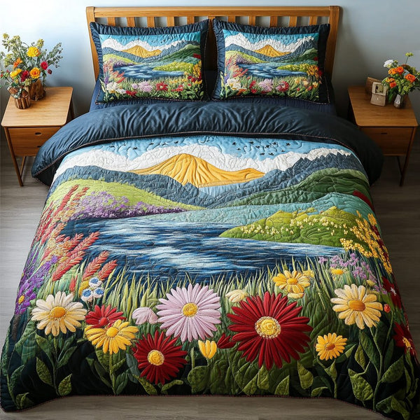 Sunset Shores quilted 3-piece bedding set on a made bed in a light coastal bedroom