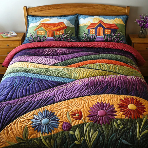 Sunset Shores quilted 3-piece bedding set on a made bed in a light coastal bedroom