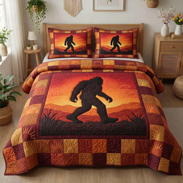 Sunset Silhouette Bigfoot quilted 3-piece bedding set on a made bed with two matching pillow shams