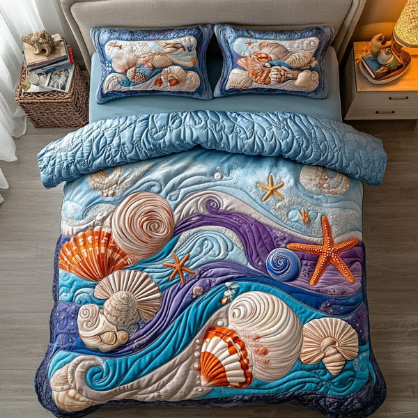 Sunset Surf quilted 3-piece bedding set on a made bed in a light coastal bedroom