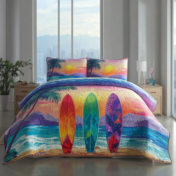 Sunset Surf quilted 3-piece bedding set on a made bed in a light coastal bedroom