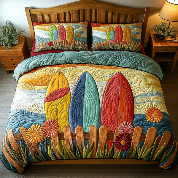 Sunset Surfboard quilted 3-piece bedding set on a made bed with two matching pillow shams