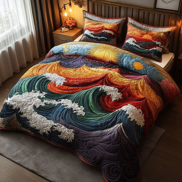 Sunset Swells quilted 3-piece bedding set on a made bed with two matching pillow shams