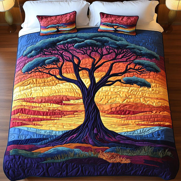 Sunset Tree quilted 3-piece bedding set on a made bed with two matching pillow shams