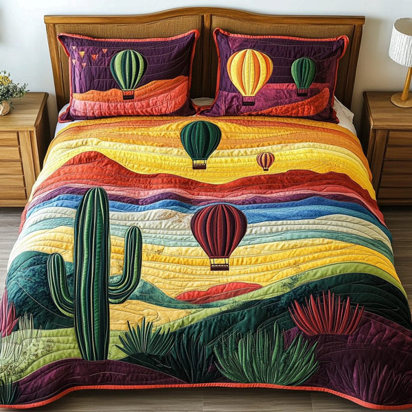 Sunset Voyage quilted 3-piece bedding set on a made bed with two matching pillow shams