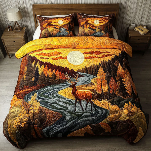 Sunset Wilderness quilted 3-piece bedding set on a made bed with two matching pillow shams