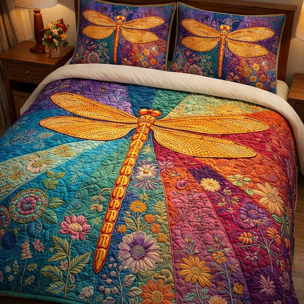 Sunset Wings quilted 3-piece bedding set on a made bed with two matching pillow shams