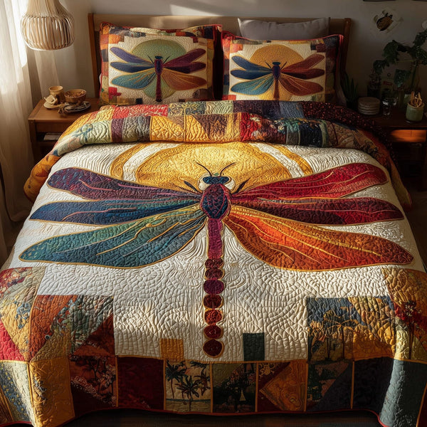 Sunshine Dragonfly quilted 3-piece bedding set on a made bed with two matching pillow shams