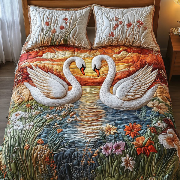 Swan Embrace quilted 3-piece bedding set on a made bed with two matching pillow shams
