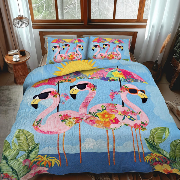 Sweet Flamingo quilted 3-piece bedding set on a made bed with two matching pillow shams