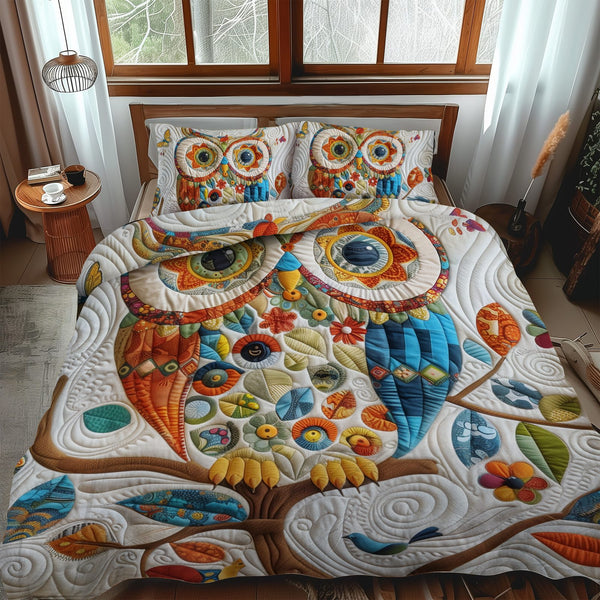 Sweet Owl quilted 3-piece bedding set on a made bed with two matching pillow shams