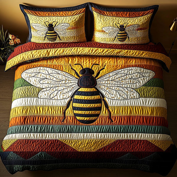 Sweet Pollen quilted 3-piece bedding set on a made bed with two matching pillow shams