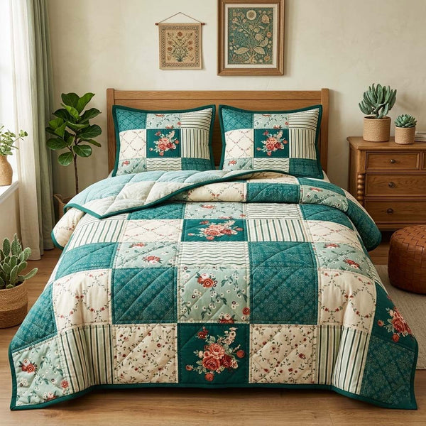 Teal Blooms quilted 3-piece bedding set on a made bed with two matching pillow shams