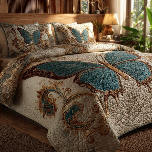 Teal Monarch quilted 3-piece bedding set on a made bed with two matching pillow shams