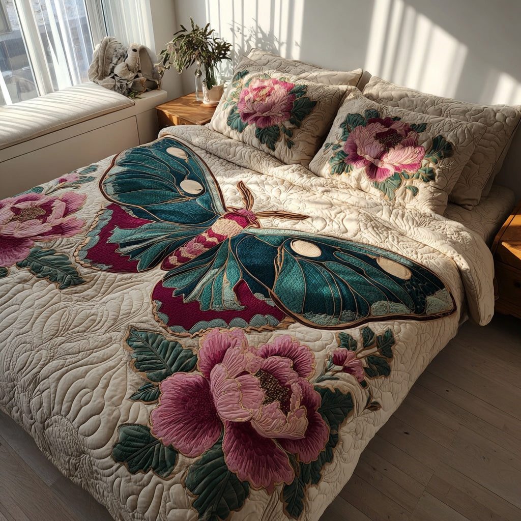 Teal Moth quilted 3-piece bedding set on a made bed with two matching pillow shams