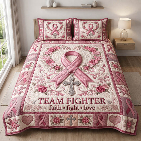 Team Fighter Breast Cancer quilted 3-piece bedding set on a made bed with two matching pillow shams