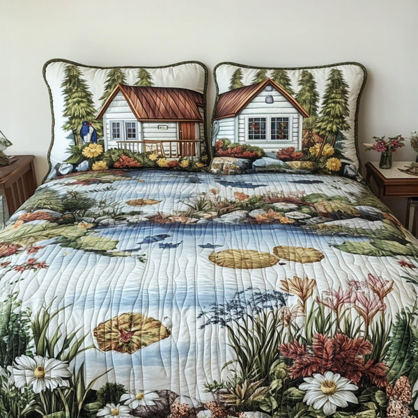 The Catch and Release quilted 3-piece bedding set on a made bed with two matching pillow shams