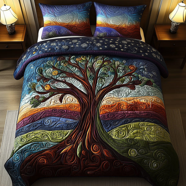 The Celestial Tree quilted 3-piece bedding set on a made bed with two matching pillow shams